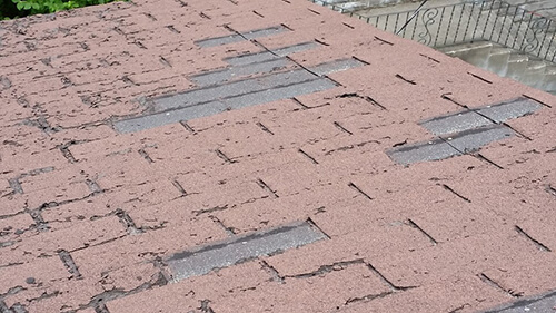 badly damaged shingles in need of roof repair - A1 Pro Roofing Ottawa Kanata Orleans