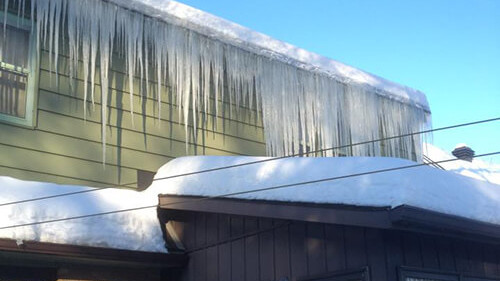 snow and ice removal, ice about to fall off of roof - A1 Pro Roofing Ottawa Kanata Orleans