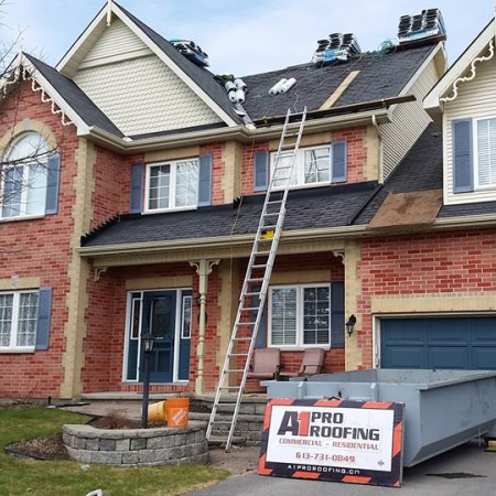 roofing project in progess, ladder leads up to roof, shingles sit atop roof - A1 Pro Roofing Ottawa Kanata Orleans