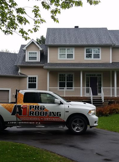 roofing project complete, A1 pro roofing truck sits in driveway - A1 Pro Roofing Ottawa Kanata Orleans